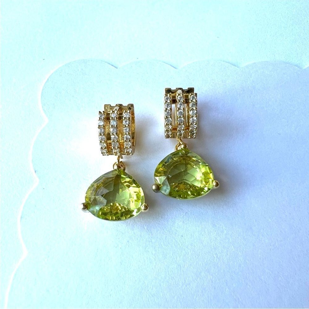 Green Peridot colored crystal earrings on gold huggie hoops.